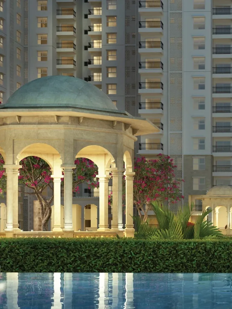 A domed pavilion beside a pool below the towers of SOBHA Royal Pavilion