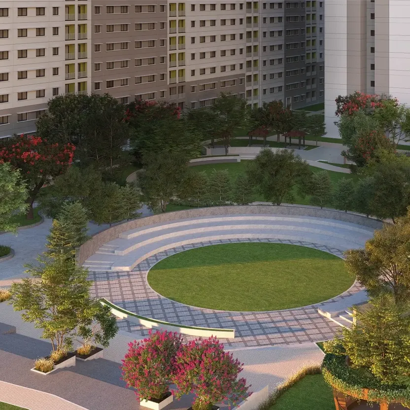 A central lawn, a sunken court and play areas ringed by towers at SOBHA Dream Acres