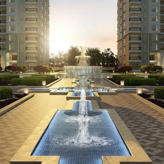 A water channel plaza with fountains between towers at SOBHA Royal Pavilion